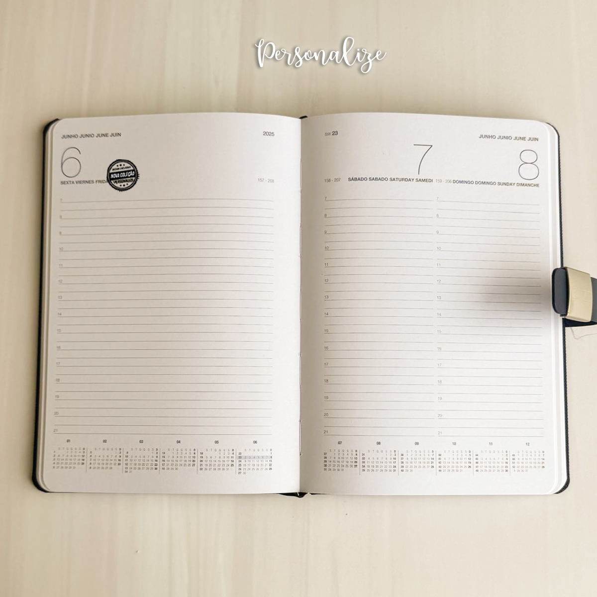 Agenda diária A5 2026 com caneta "Acreditar é o primeiro passo..."